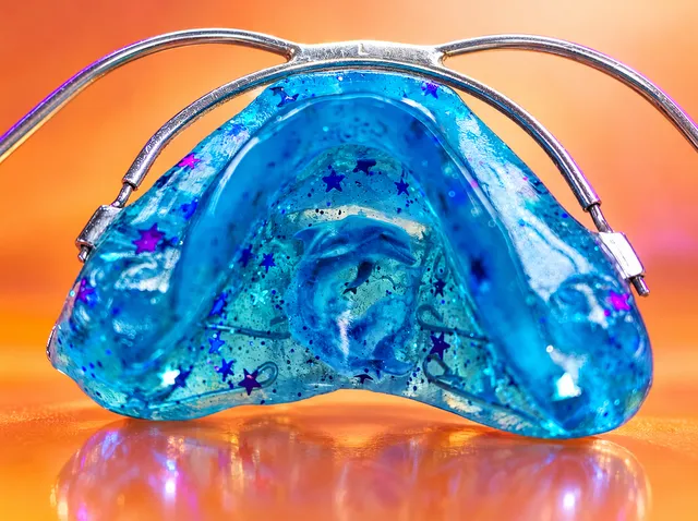 Turquoise with violet-turquoise stars and a leaping dolphin
