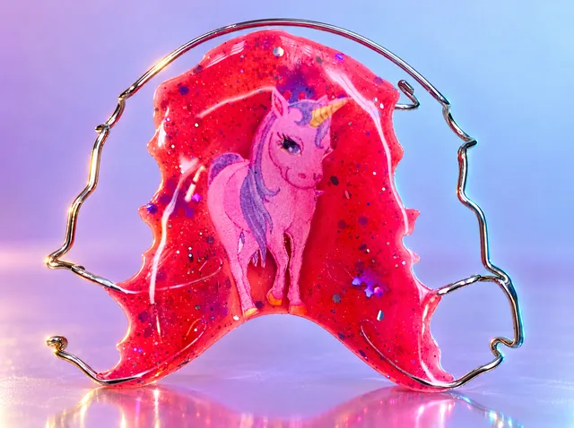 Matt pink with blue snowflakes and a unicorn