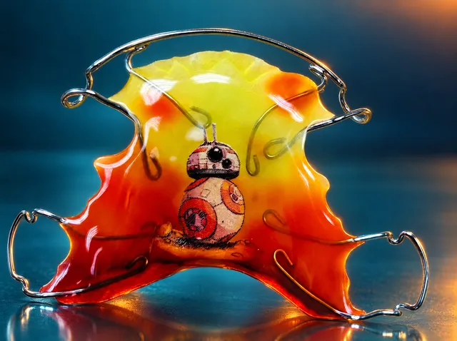 Yellow-orange with a robot
