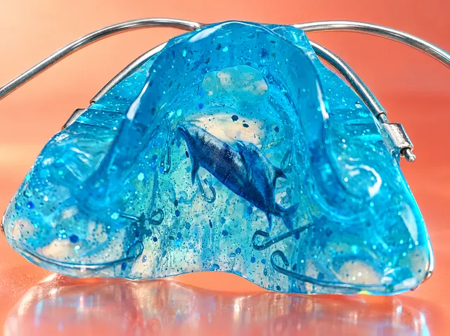 Turquoise with blue snowflakes and a dolphin mother with her baby